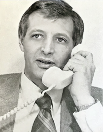 Photo of Ed David talking on the phone