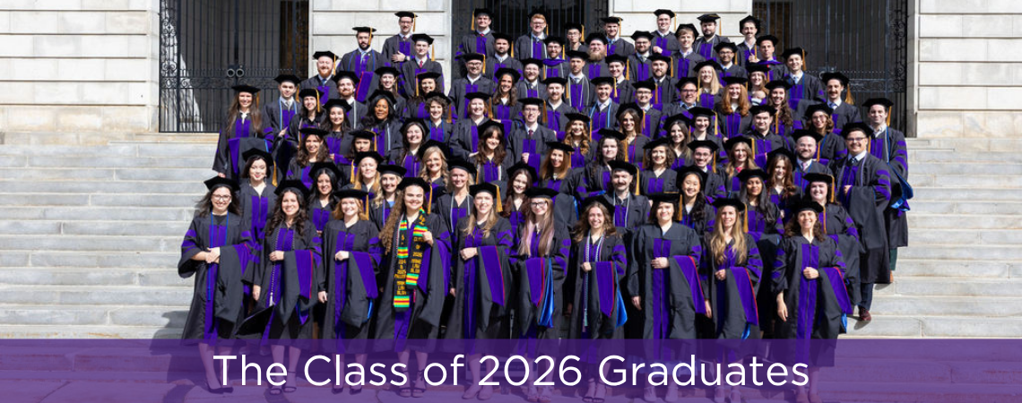 The Class of 2026 stands on the steps of city hall in their robes and hats and teh caption on the photo reads "The Class of 2026 Graduates"