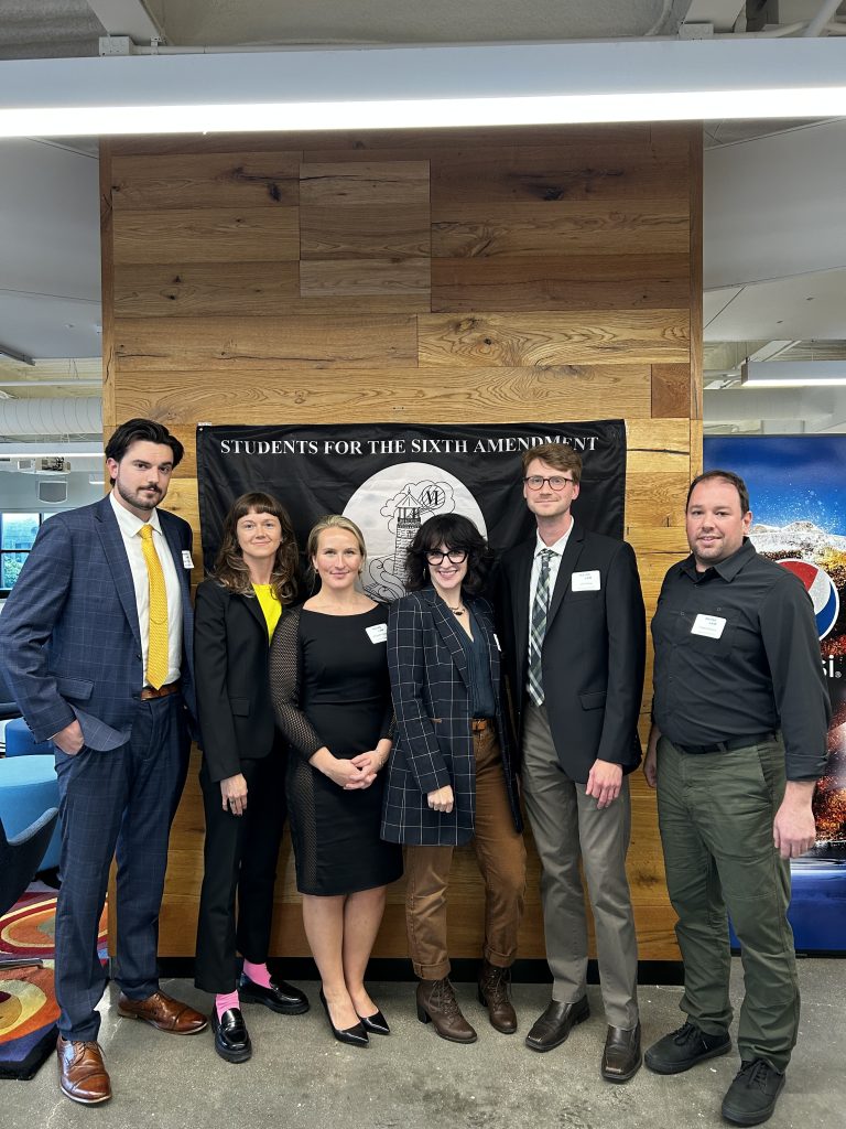 Photo of students for the sixth amendment standing in the Maine Law lobby.