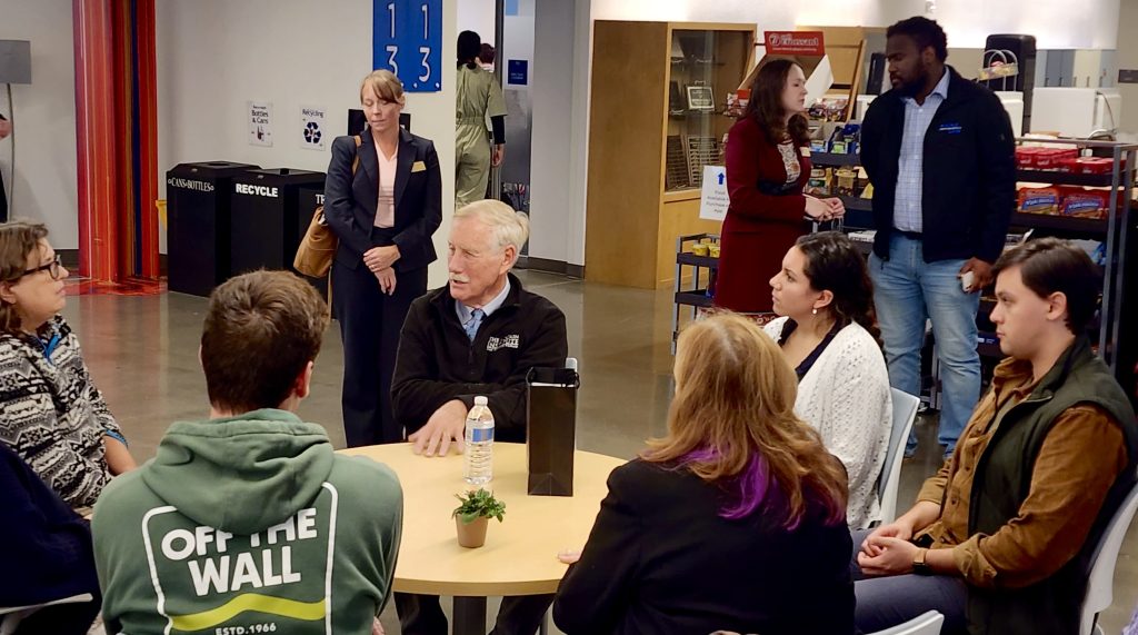 Senator King sits at a table with Maine Law students