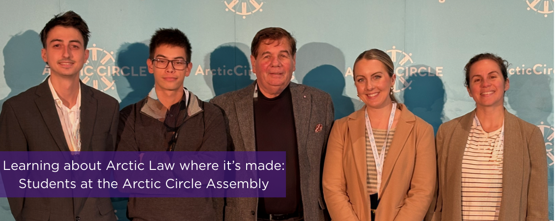 Arctic Assembly Photo of faculty and students standing in front of a sign that reads "Arctic Assembly"