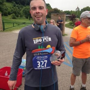 Picture of Jon Lee finishing a half-marathon 